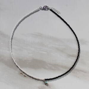 Black and White Beaded Necklace with Tiny Charm
